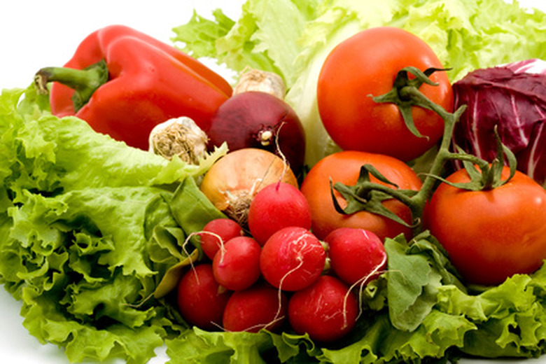 An assortment of fresh vegetables on a table.