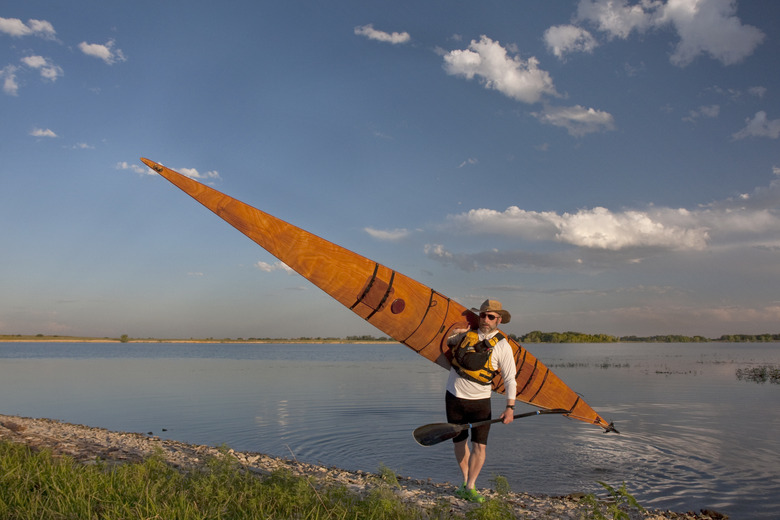 paddler with wooden sea kayak