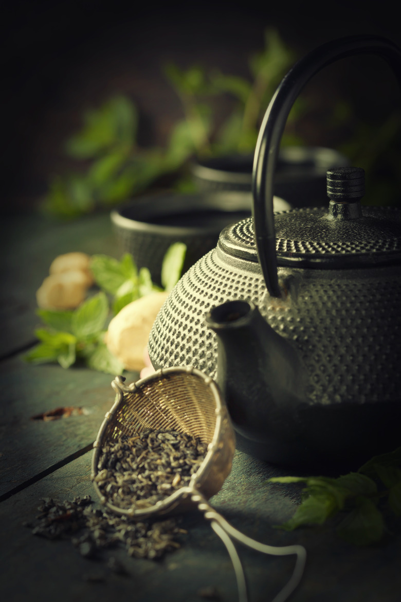 Japanese teapot and cups with mint tea