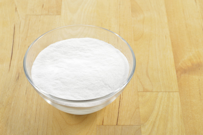 Close-up of baking soda in a glass bowl.