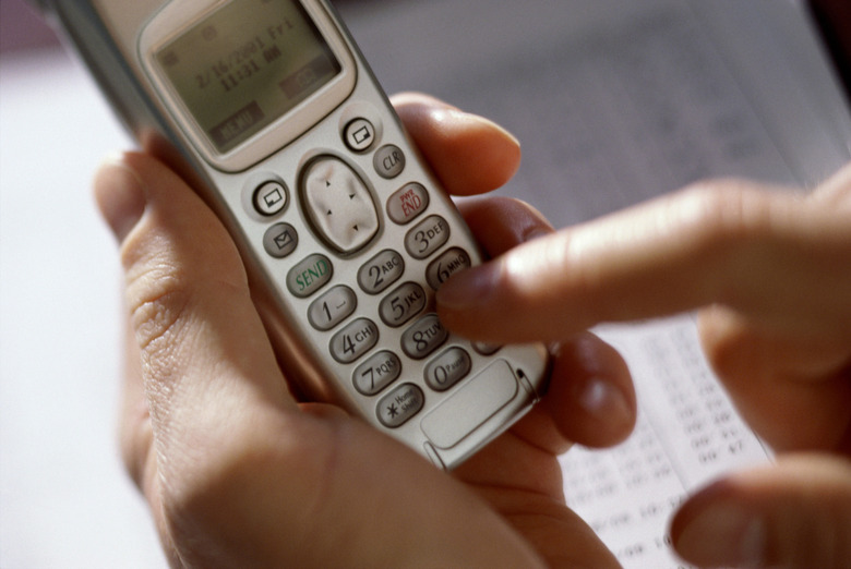 Person operating a mobile phone