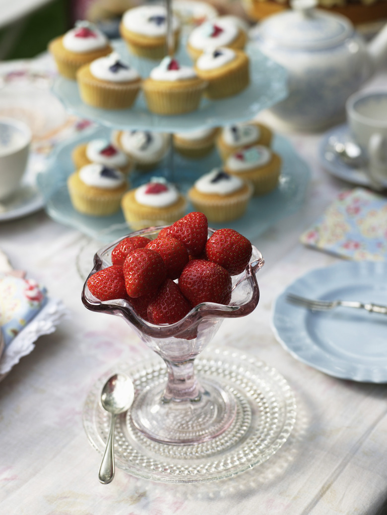 Strawberries in stemmed glass bowl, close-up