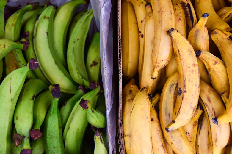 Green and yellow plantains side by side.