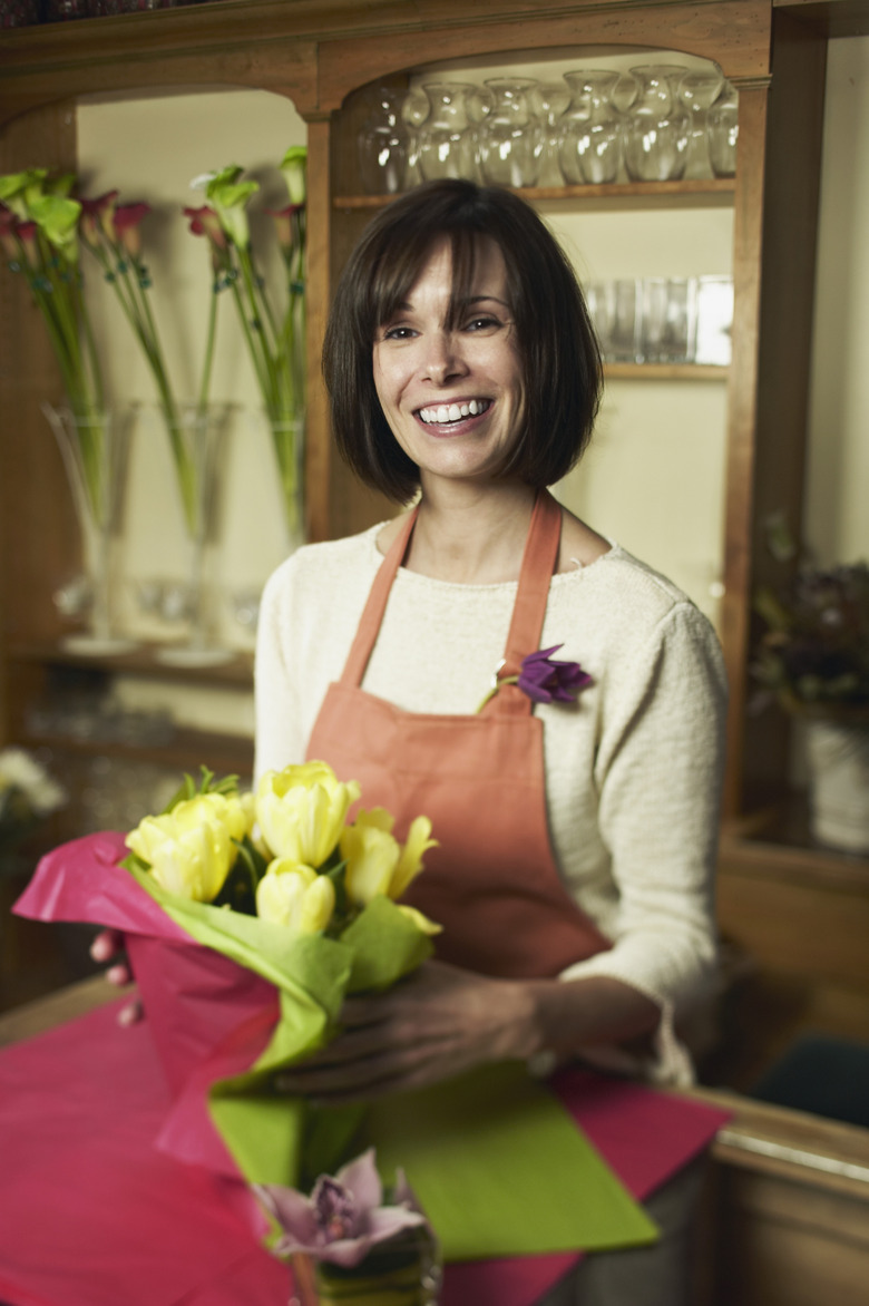 Clerk wrapping up flowers