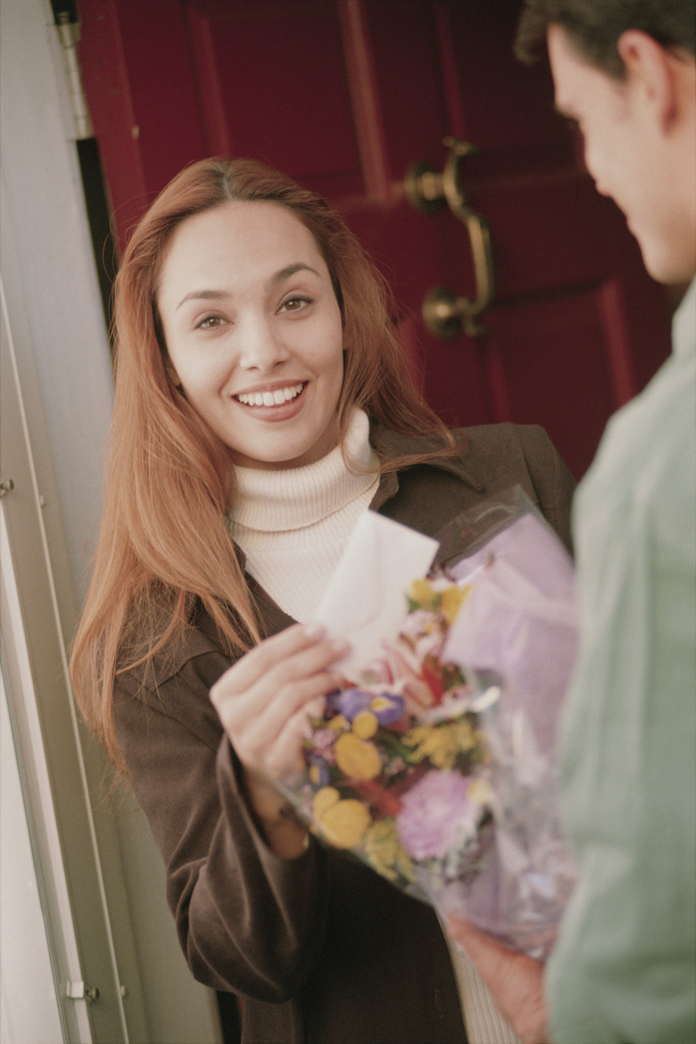 Woman receiving flower delivery